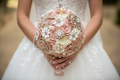 Curated and hand finished blush pink and rose gold satin flower bridal bouquet adorned with crystals and pearls carefully placed to sparkle. Simply stunning.